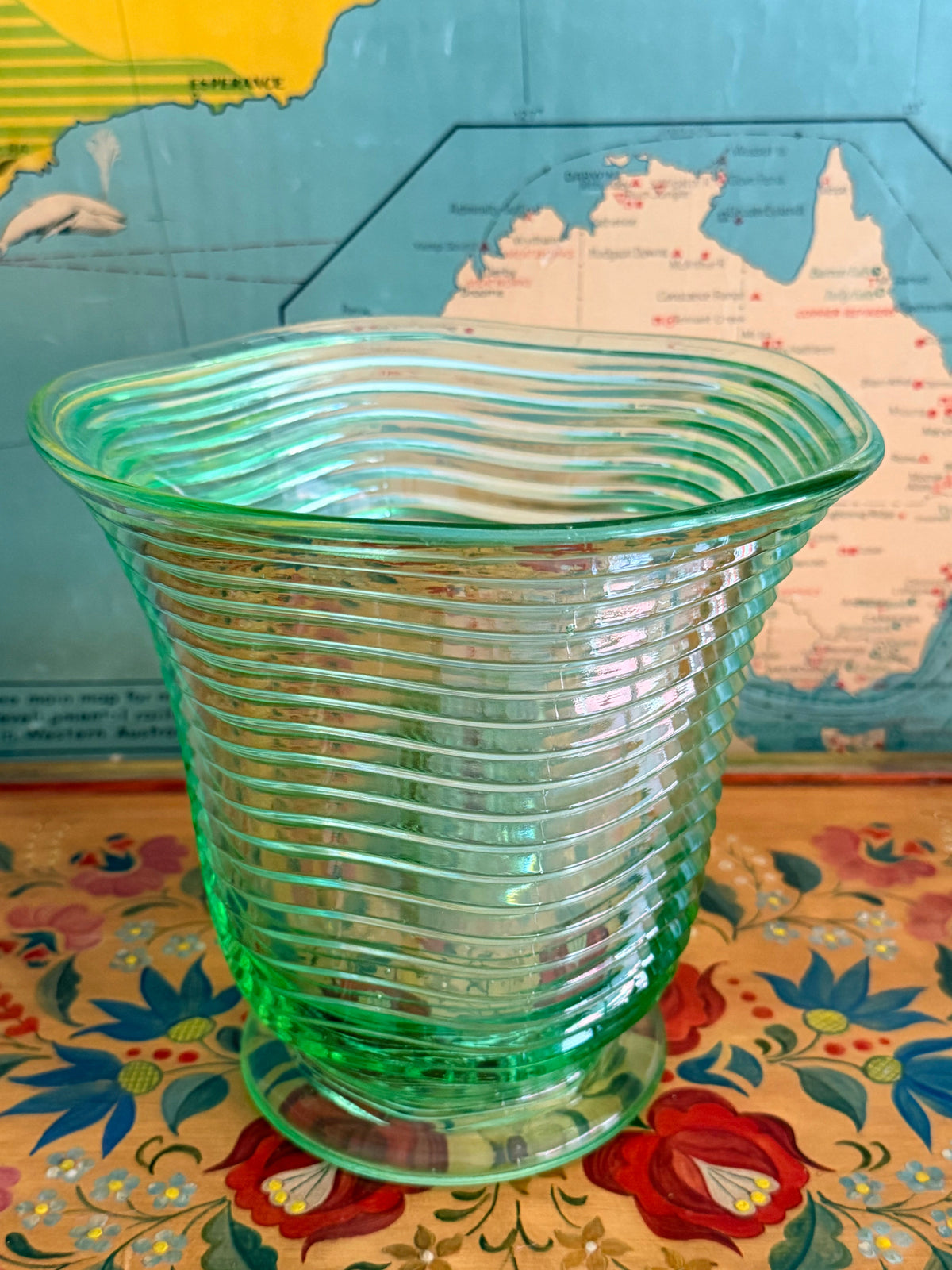 A  vintage translucent green ribbed glass vase 