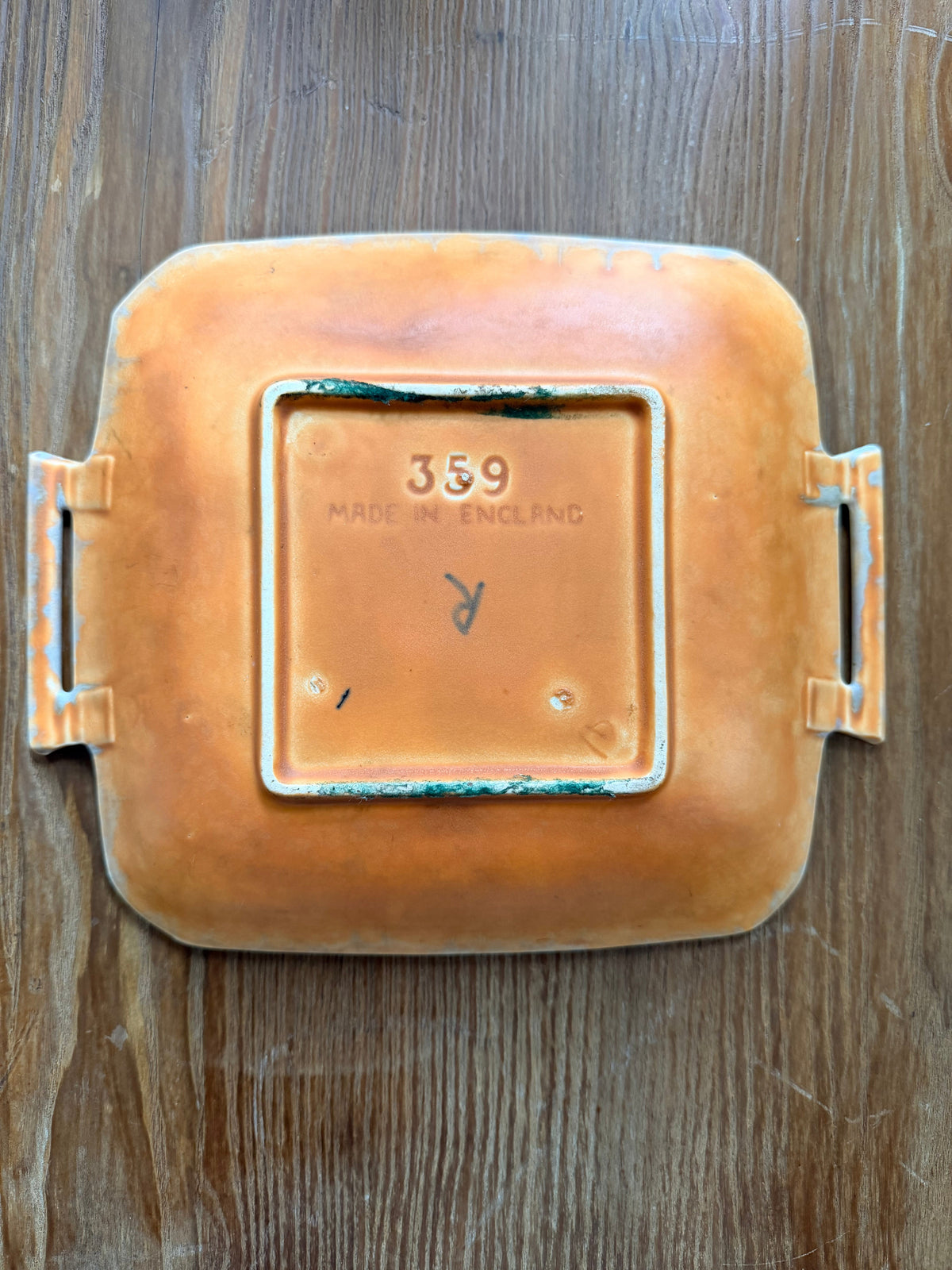 A beswick plate with side handles, bottom of the plate