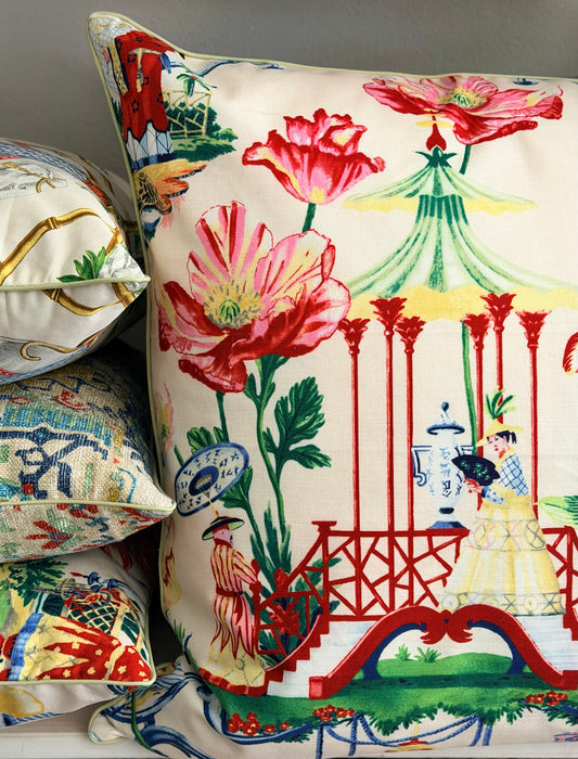 stack of chinoiserie cushions with bold blooms and a pagoda