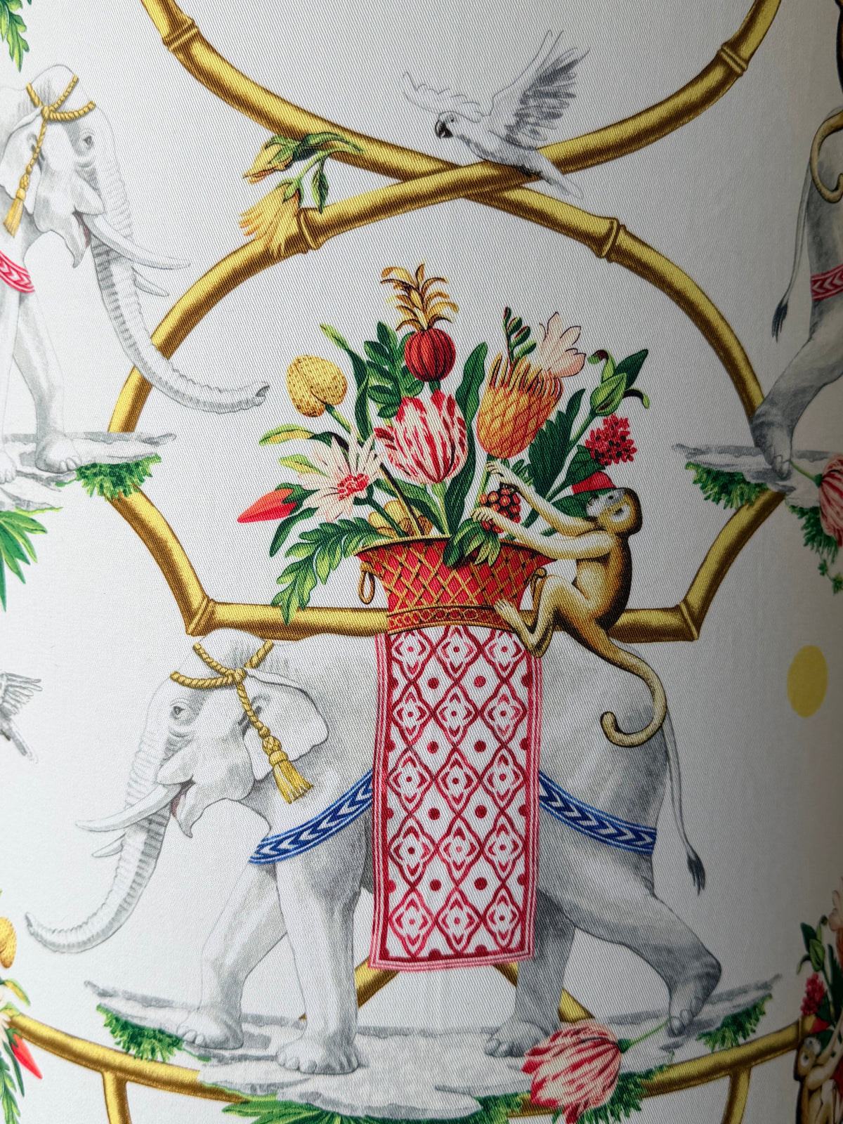 tall classic british india style lampshade with elephants and monkeys close up