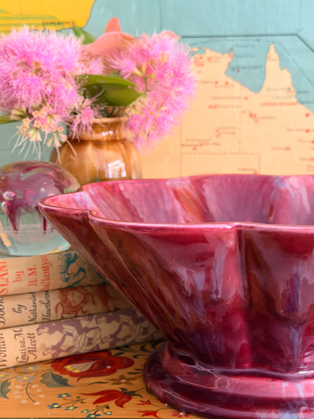 A glossy marbled deep magenta-purple ceramic bowl with a fluted rim.