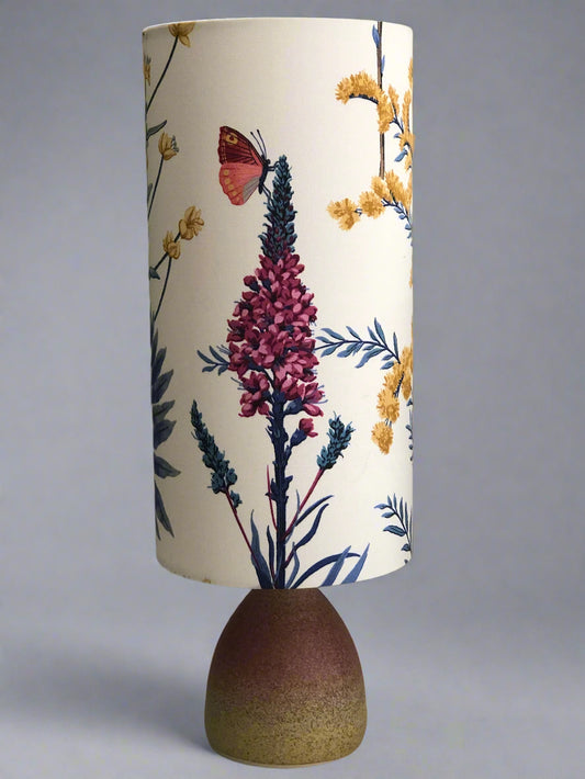 Decorative lamp with floral design on a white background