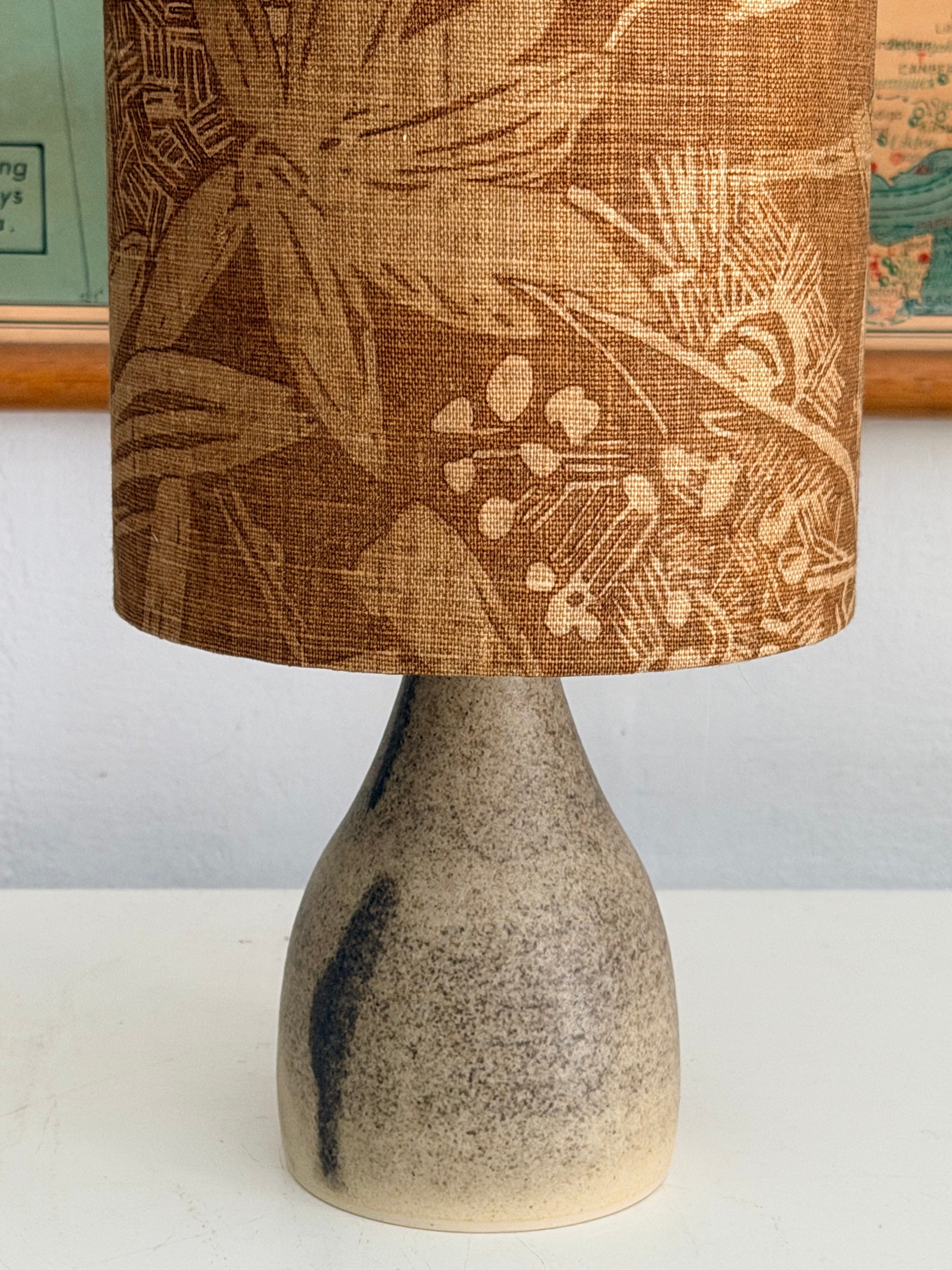 close up crackle glaze aj lamp with tobacco tiki lampshade