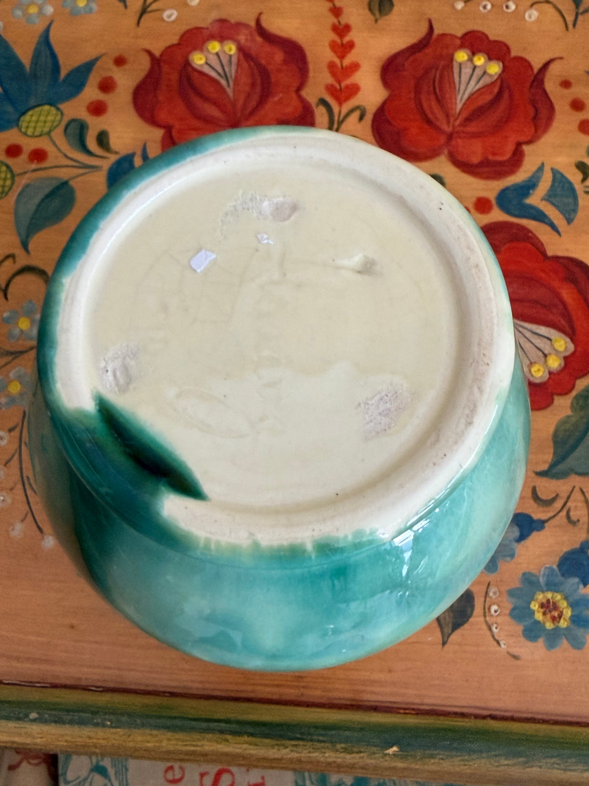 A ceramic Mashman vase with a blue-green and cream gradient glaze 