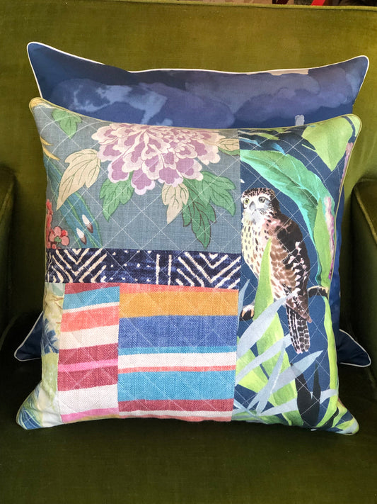 Decorative pillow with patchwork design on a green background