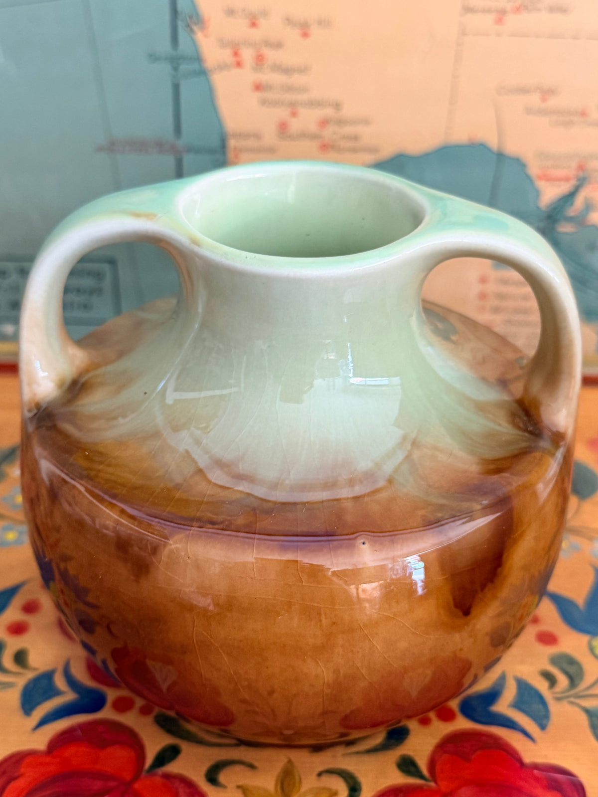 Art deco drip glaze twin handled Newtone vase in light  green and chocolate