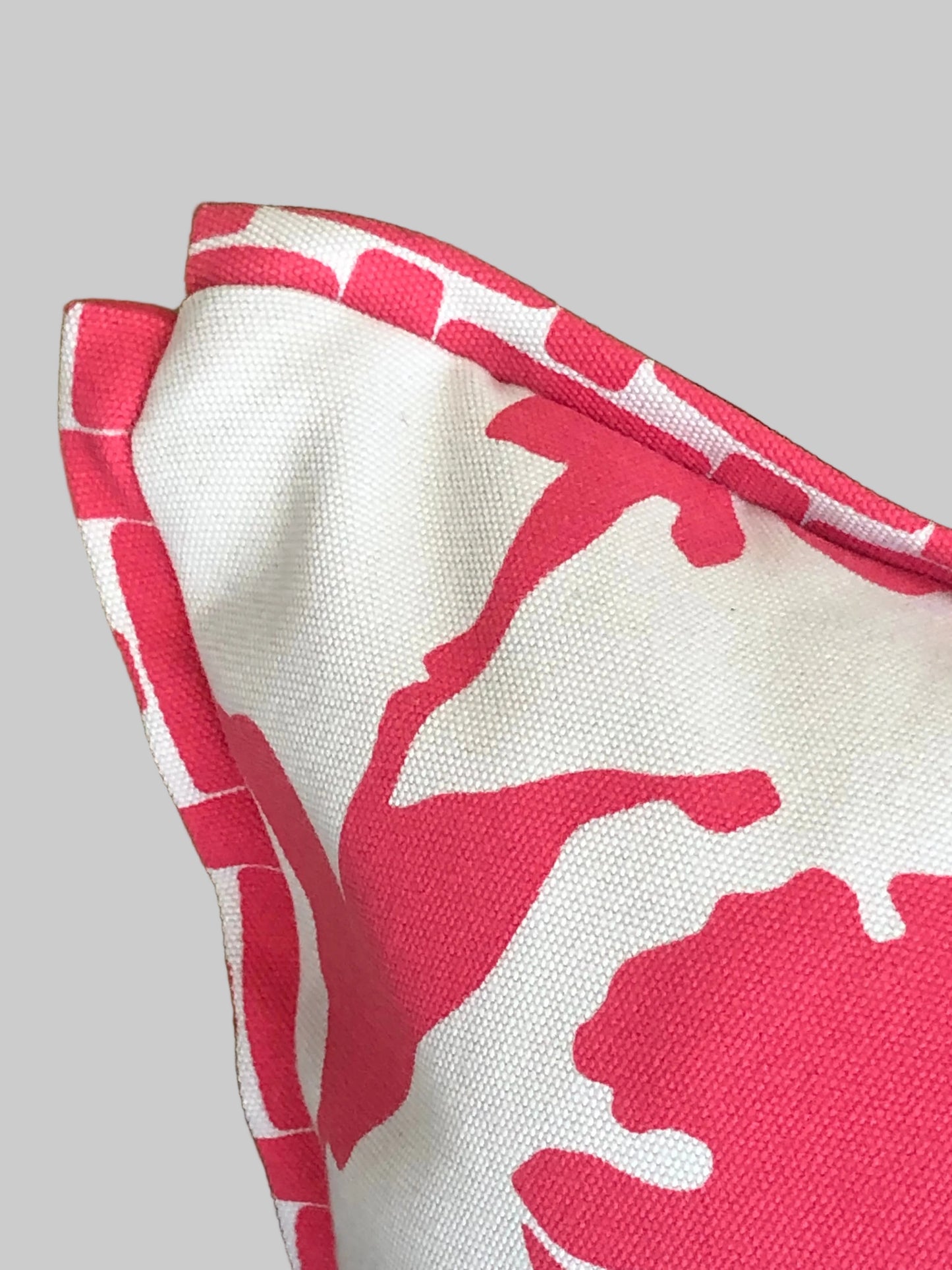 close up detail of bloom bordered outdoor cushion