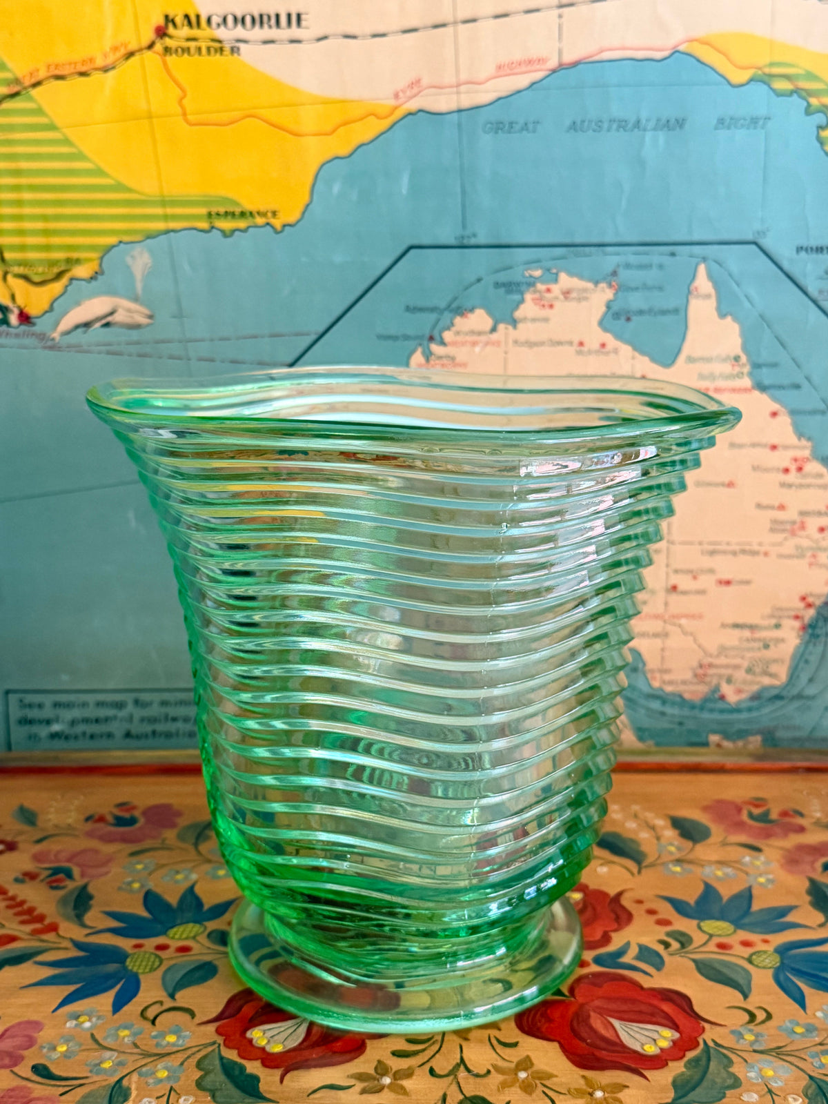 A  vintage translucent green ribbed glass vase 
