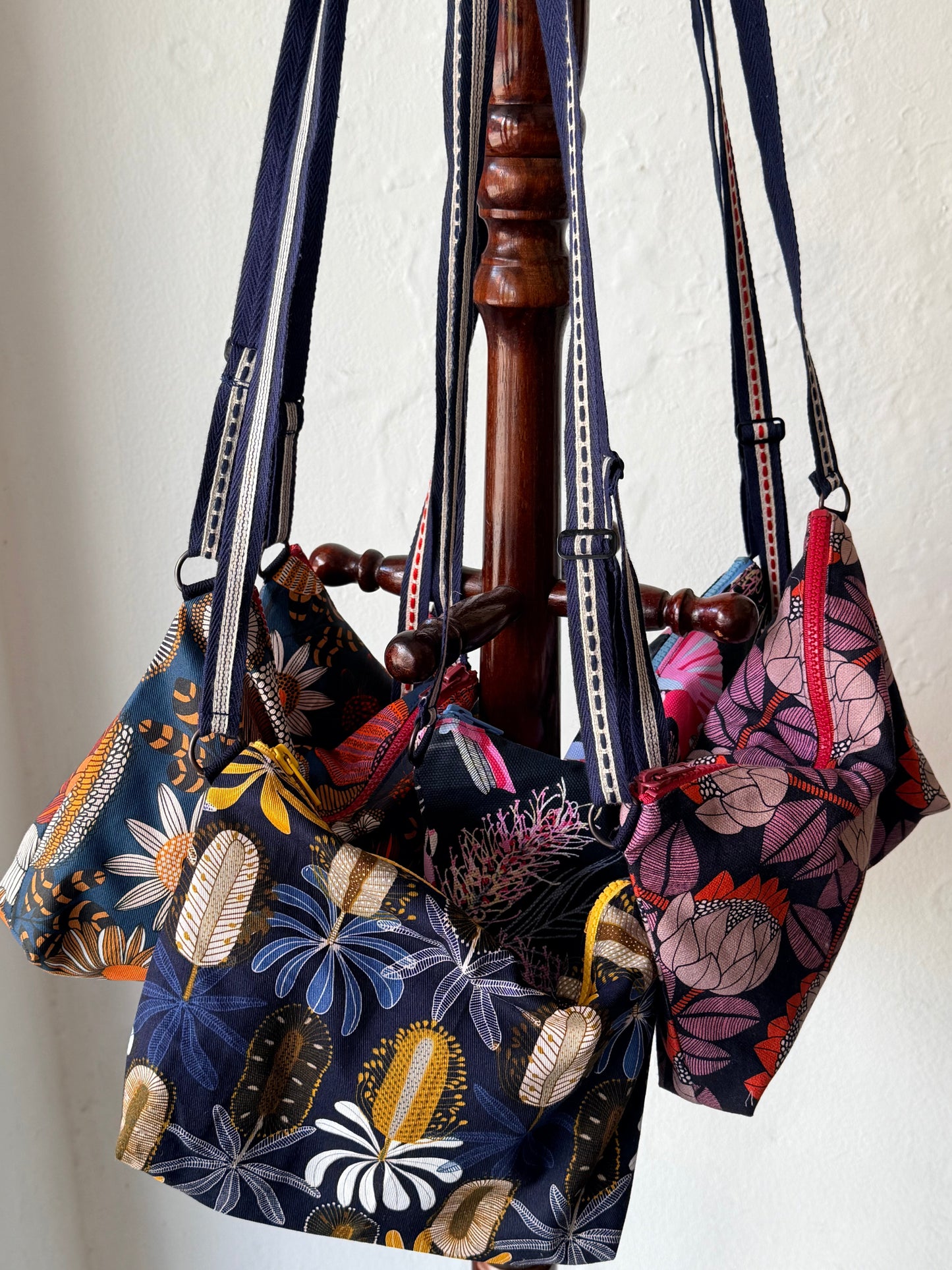 groupd australian native print crossbody bags