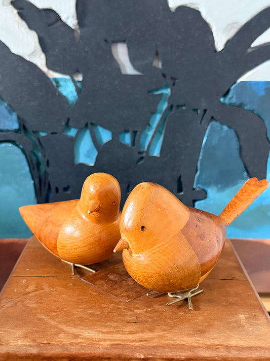 Two small carved wooden scandi retro birds with metallic wire legs.