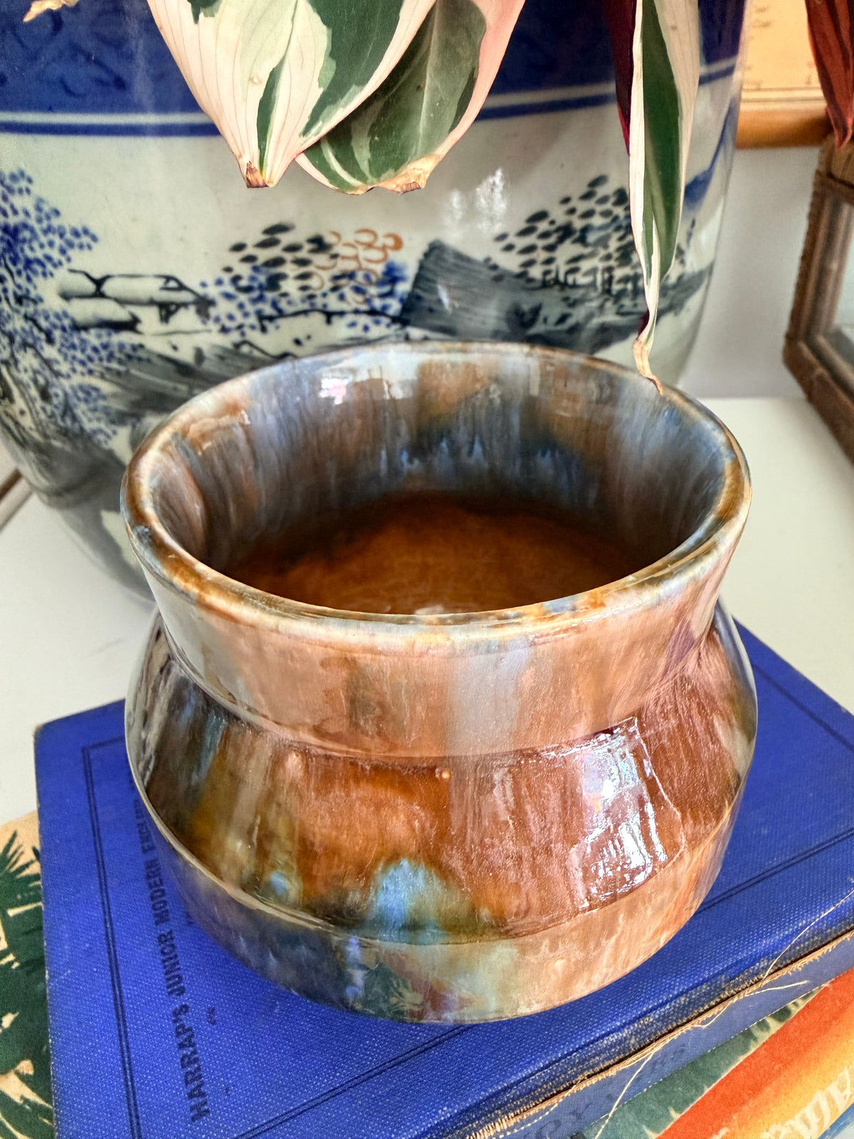 A retro Mashman ceramic pot with a glossy, marbled glaze in earthy brown, blue and dark gray tones