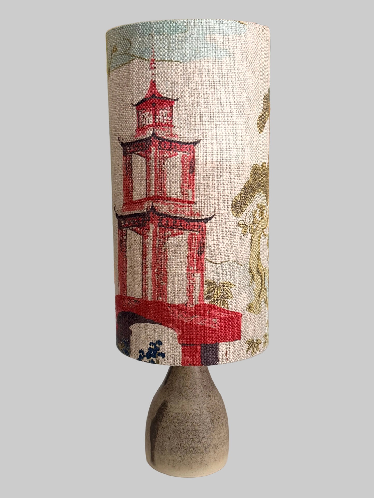 shinto temple and ginseng lampshade on a crackle glaze aj hand
thrown lamp base