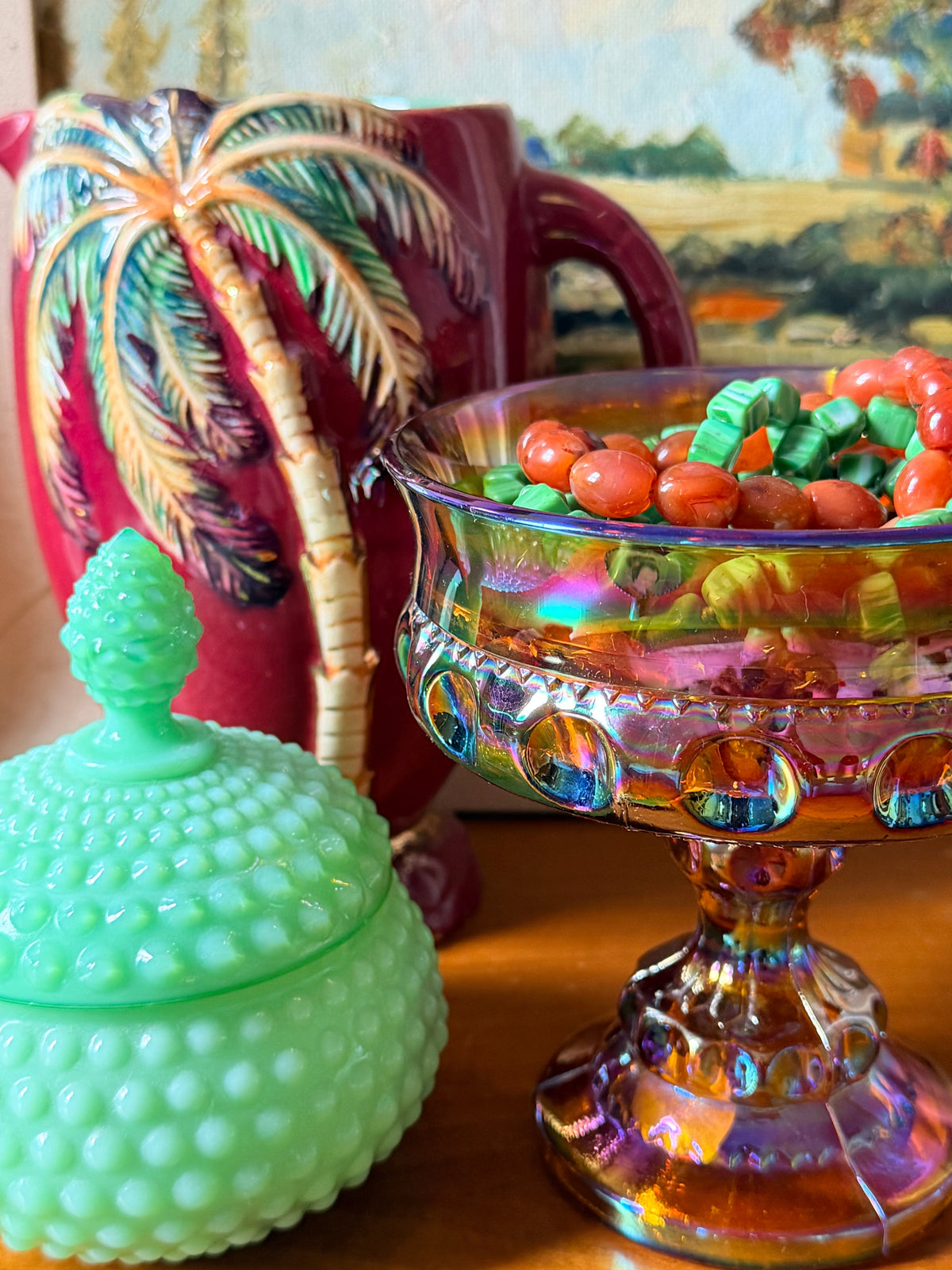 An iridescent carnival glass pedestal bowl , compote, with a gold-amber base and rainbow reflections, 