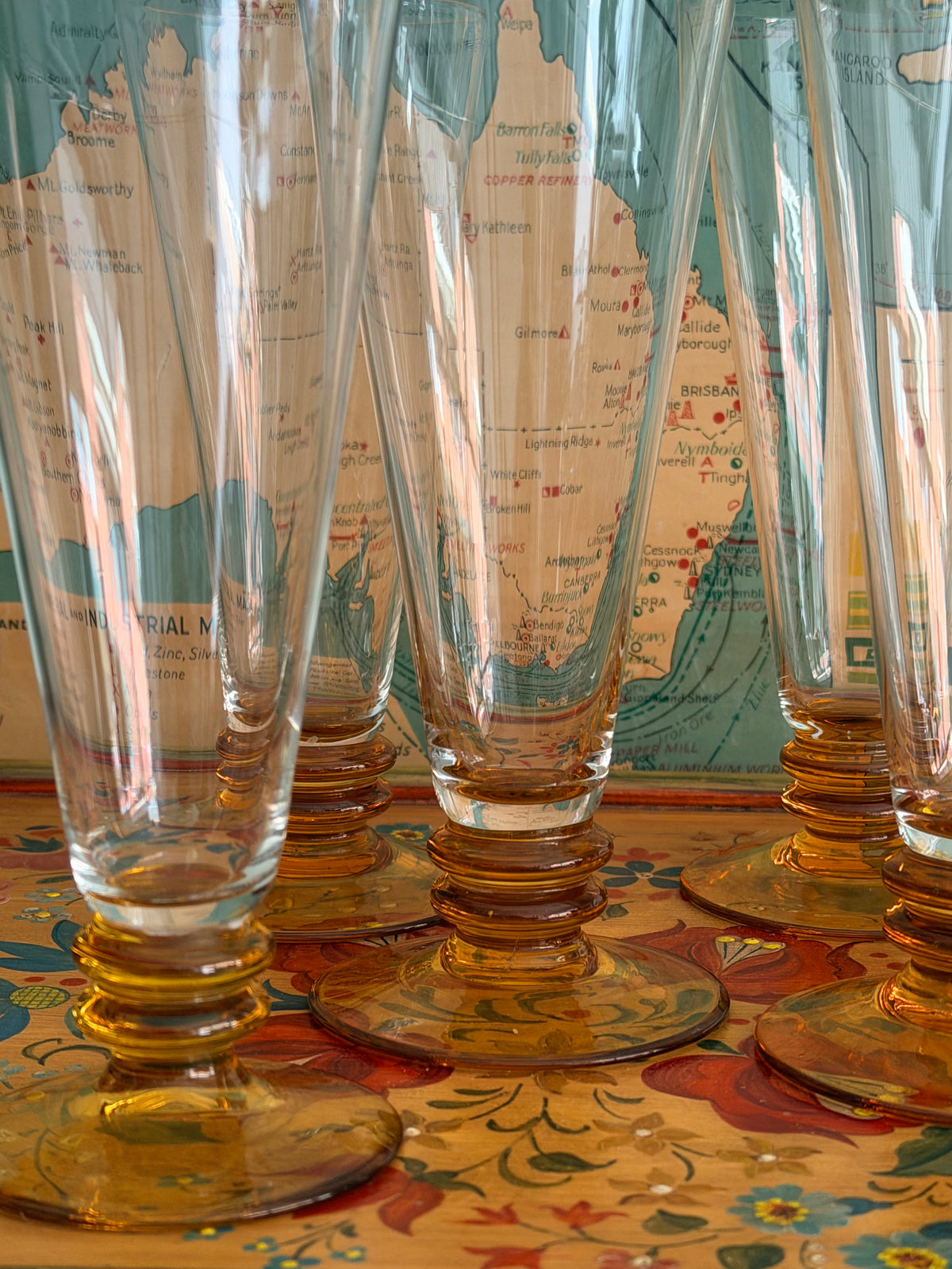 A close-up of several amber glass flutes 