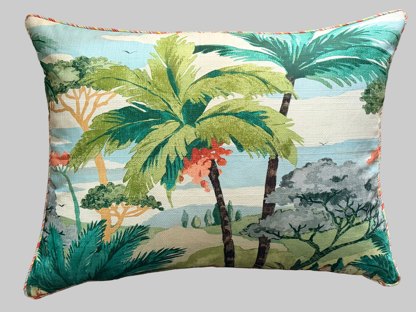 Decorative pillow with tropical palm tree design on a textured surface