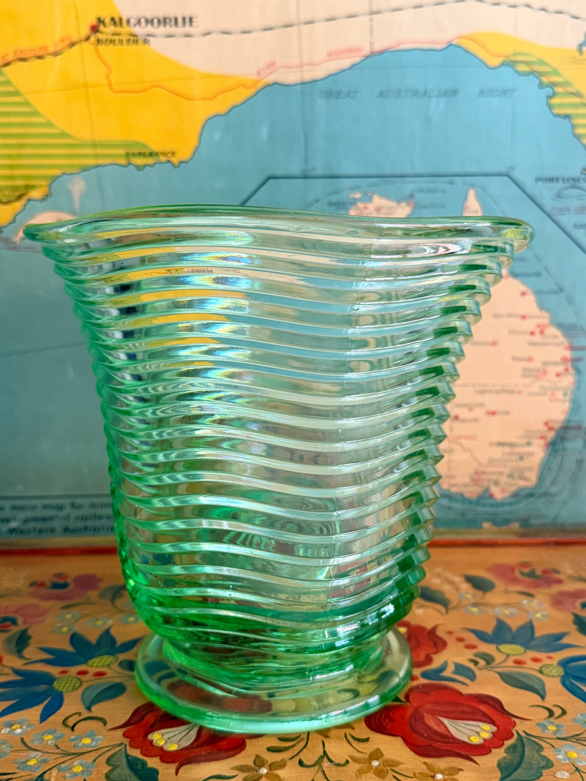 A  vintage translucent green ribbed glass vase 