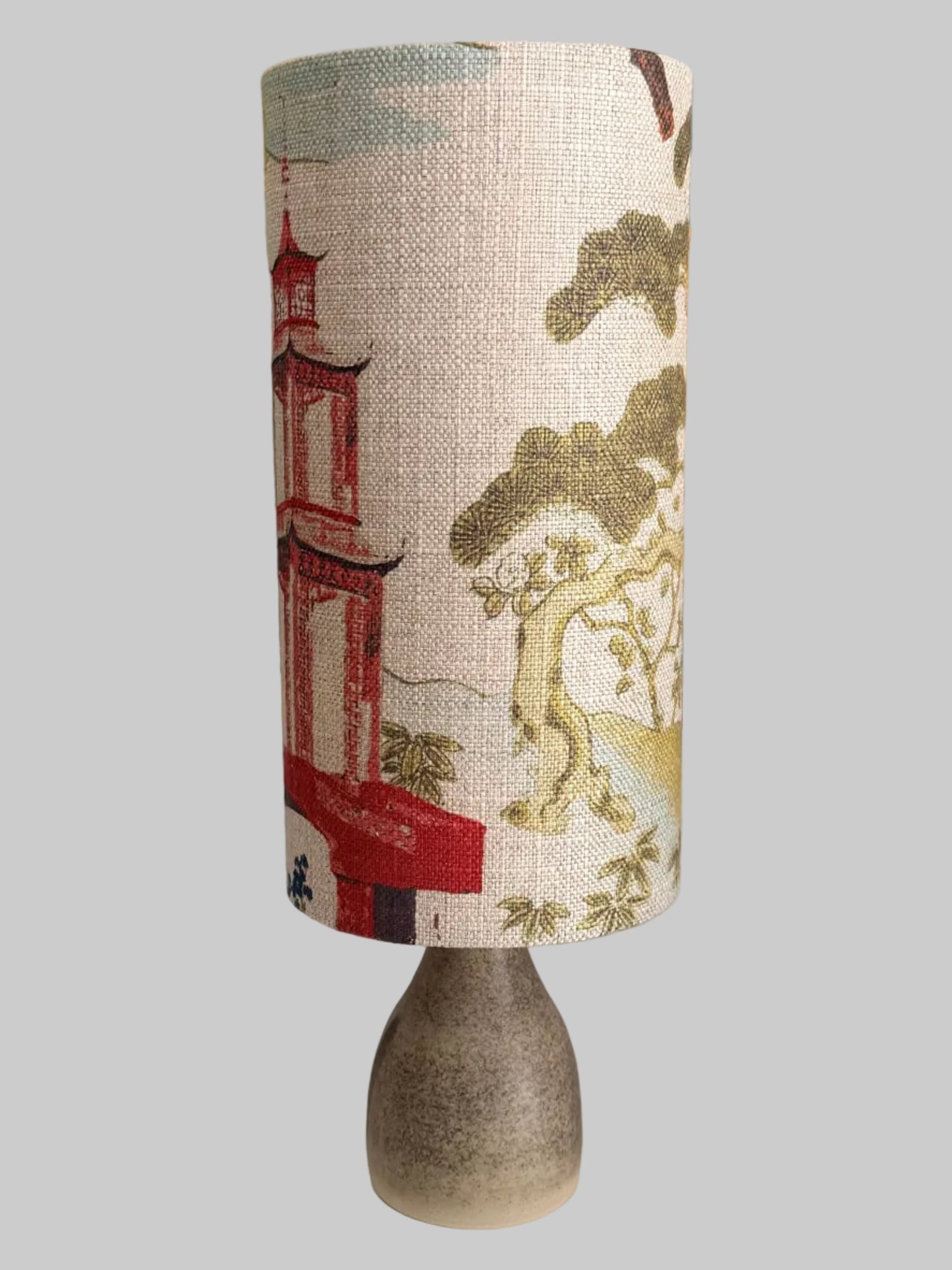 shinto temple and ginseng lampshade on a crackle glaze aj hand
thrown lamp base