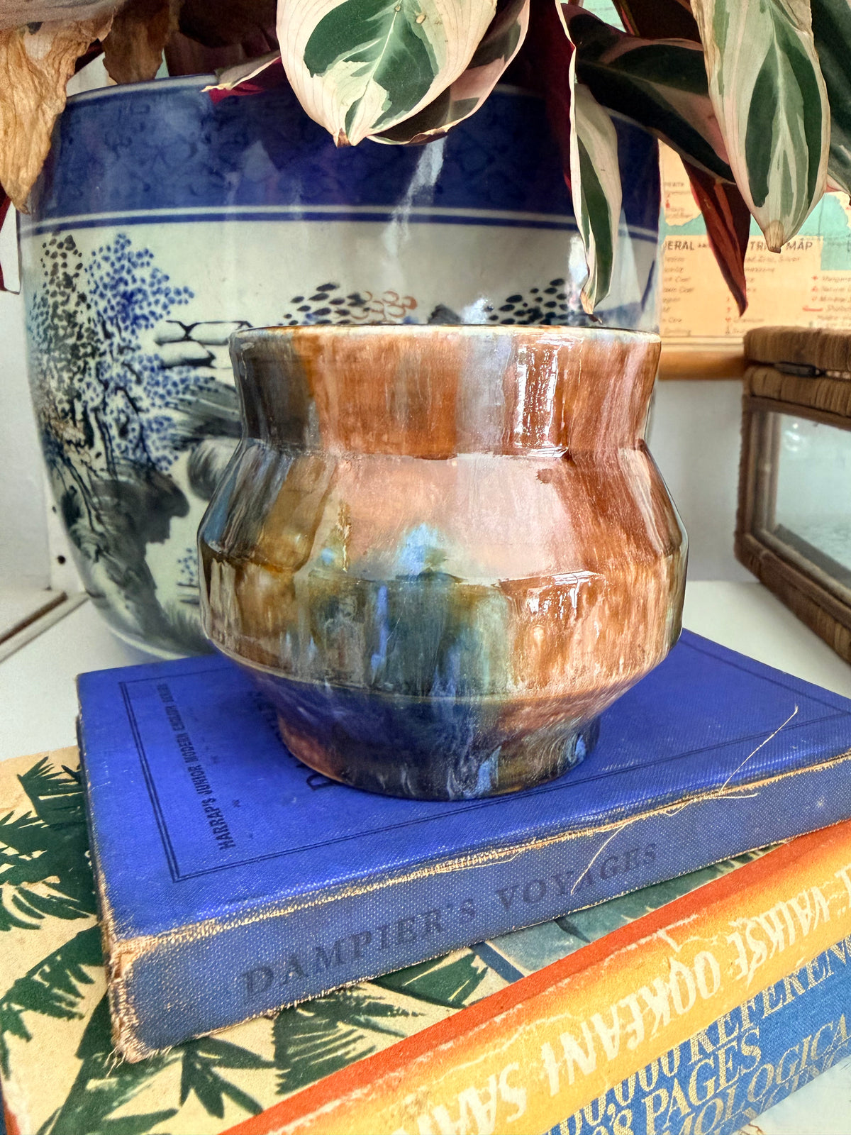 A retro Mashman ceramic pot with a glossy, marbled glaze in earthy brown, blue and dark gray tones