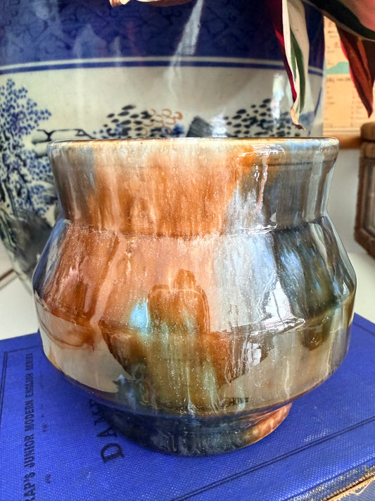 A retro Mashman ceramic pot with a glossy, marbled glaze in earthy brown, blue and dark gray tones